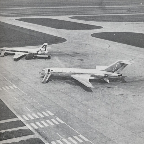 Early jet airplane on dock