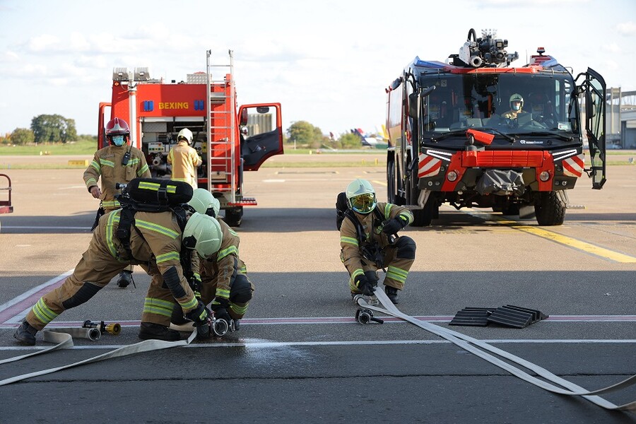 Firefighters practice in front of the new waiting room